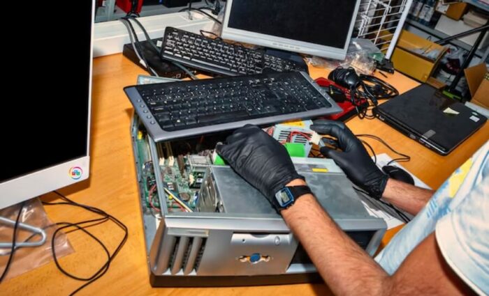 Technician repairing a laptop at a certified laptop repair center in Sainikpuri, Hyderabad