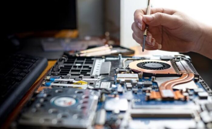 Technician repairing desktop and laptop devices at a trusted computer service center in Yapral, Hyderabad.